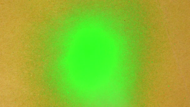 Green Screen is Sprayed on a Color Background — Stockvideo