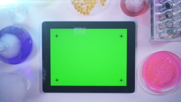 Tablet pc With a Green Screen in the Laboratory.top View — Stock Video