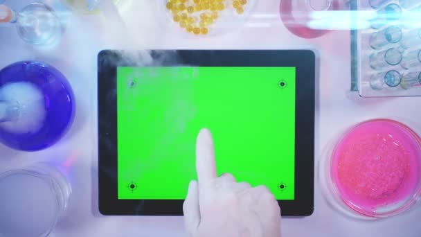 Tablet pc With a Green Screen in the Laboratory.top View — Stock Video