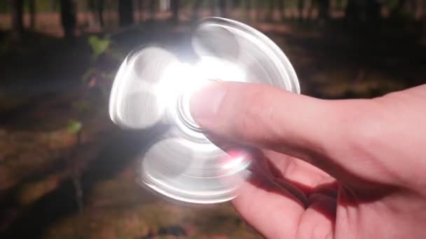 Spins the Spinner in His Hands — Stock Video