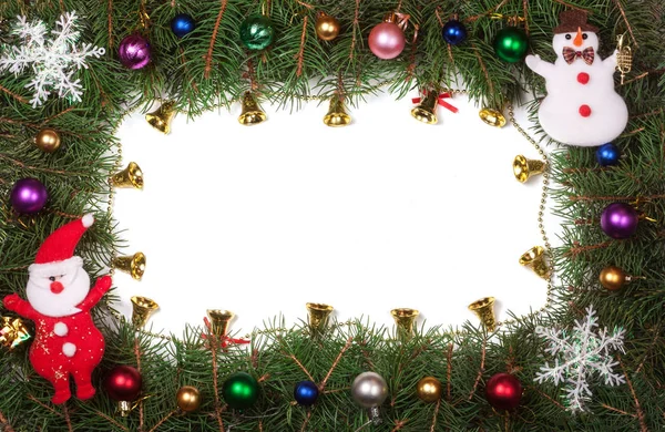 Christmas frame made of fir branches decorated with bells and balls isolated on white background — Stock Photo, Image