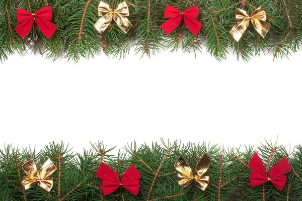 Christmas frame made of fir branches decorated with bows isolated on white background — Stock Photo, Image