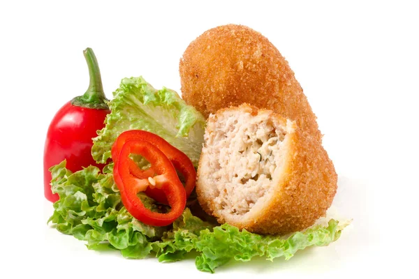 Two fried breaded cutlet with lettuce and pepper isolated on white background — Stock Photo, Image