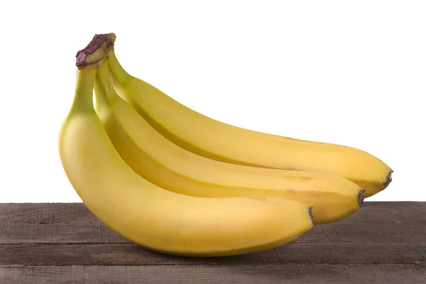 Τρεις μπανάνες σε λευκό φόντο ξύλινη σανίδα απομονωμένες — Φωτογραφία Αρχείου