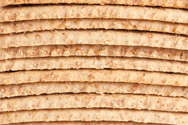 Stapel graan crispbreads als achtergrond — Stockfoto