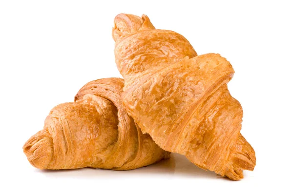 Två croissant isolerade över en vit bakgrund närbild — Stockfoto