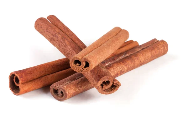 Four cinnamon sticks isolated on white background — Stock Photo, Image