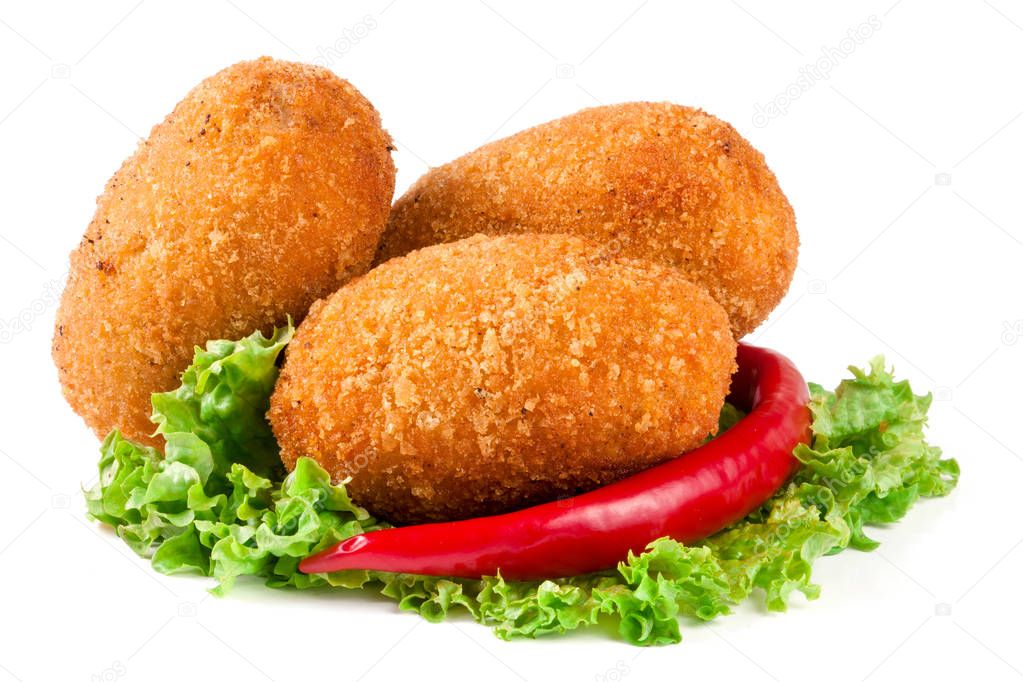 three fried breaded cutlet with lettuce and pepper isolated on white background
