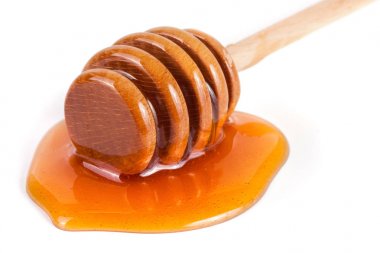 Tatlım sopa ile akan tatlım izole üzerinde beyaz arka plan