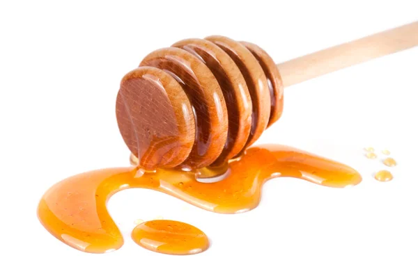 Honig-Stick mit fließendem Honig isoliert auf weißem Hintergrund — Stockfoto