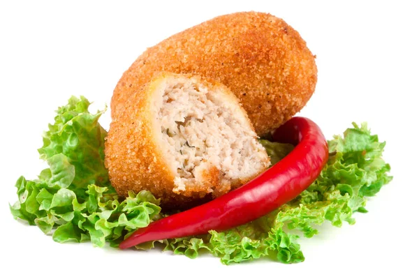 Two fried breaded cutlet with lettuce and pepper isolated on white background — Stock Photo, Image