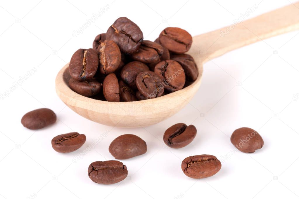 Coffee beans in a wooden spoon isolated on a white background