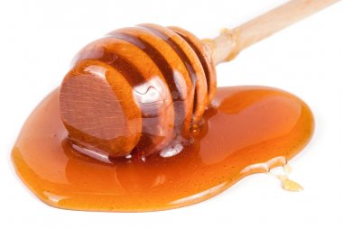 Tatlım sopa ile akan tatlım izole üzerinde beyaz arka plan