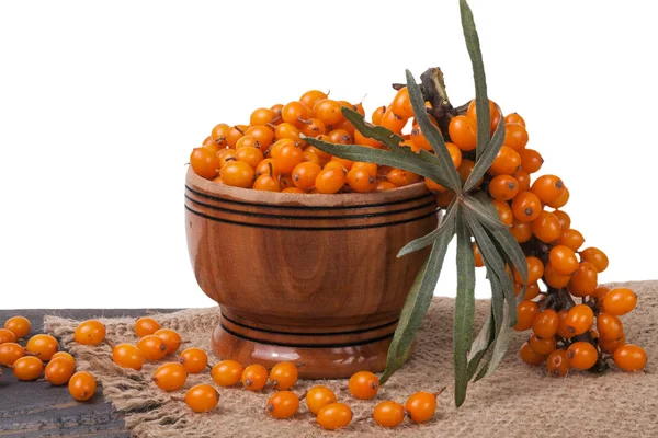 Sea-buckthorn berries in a wooden bowl on table isolated  white background — Stock Photo, Image