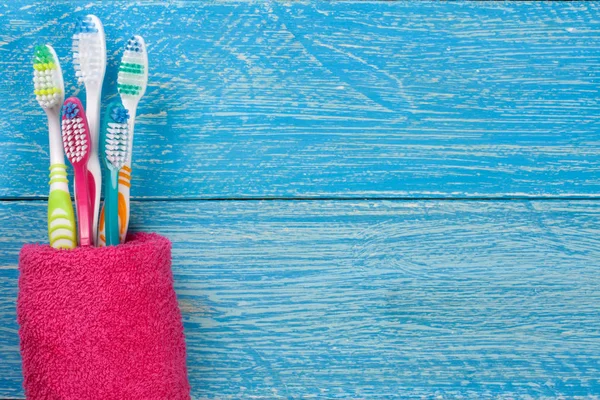 Toothbrushes on the blue wooden background with copy space for your text. Top view — Stock Photo, Image