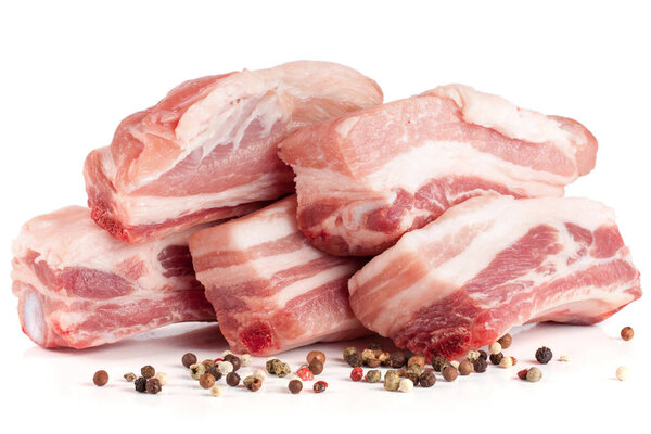 pieces of pork with peppercorn isolated on white background