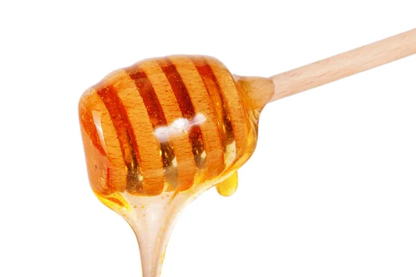 Honey stick with flowing honey isolated on white background — Stock Photo, Image