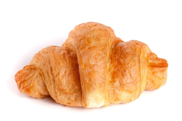 En croissant isolerad på vit bakgrund närbild — Stockfoto