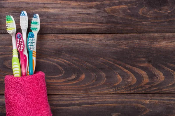 Toothbrushes on the black wooden background with copy space for your text. Top view — Stock Photo, Image