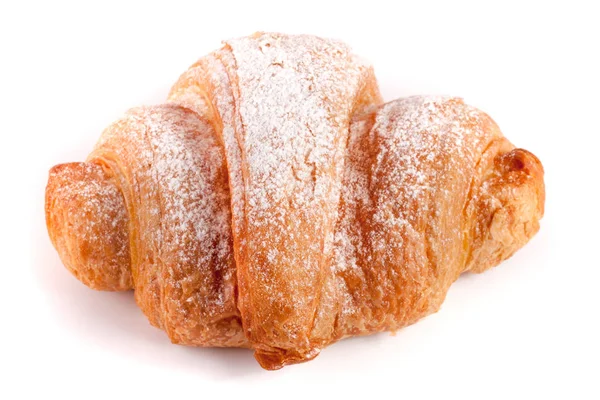 Un croissant cosparso di zucchero a velo isolato su fondo bianco primo piano — Foto Stock