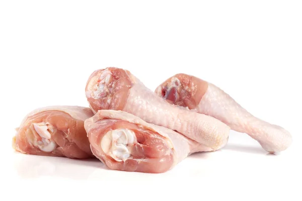 Négy nyers csirke alsócomb elszigetelt fehér background — Stock Fotó