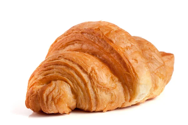 En croissant isolerad på vit bakgrund närbild — Stockfoto