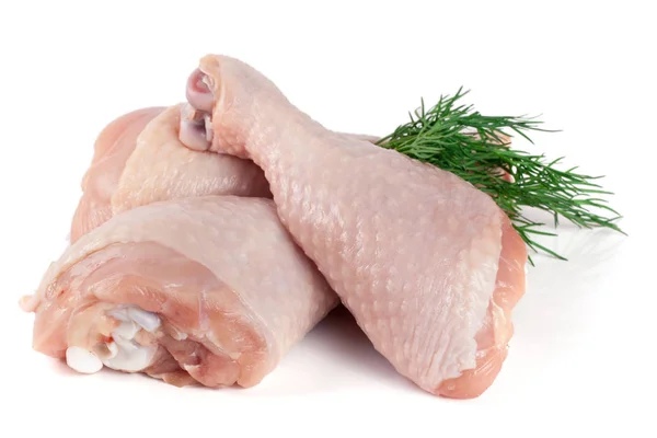 Tres palitos de pollo crudos con una ramita de eneldo aislado sobre fondo blanco — Foto de Stock