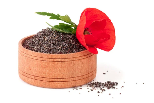 Nasiona maku w drewniane miski z kwiatem — Zdjęcie stockowe