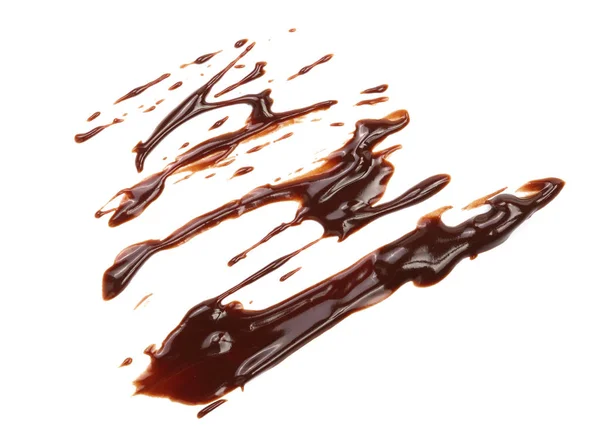 Heiße geschmolzene Schokolade Gießen isoliert auf weißem Hintergrund, Ansicht von oben — Stockfoto