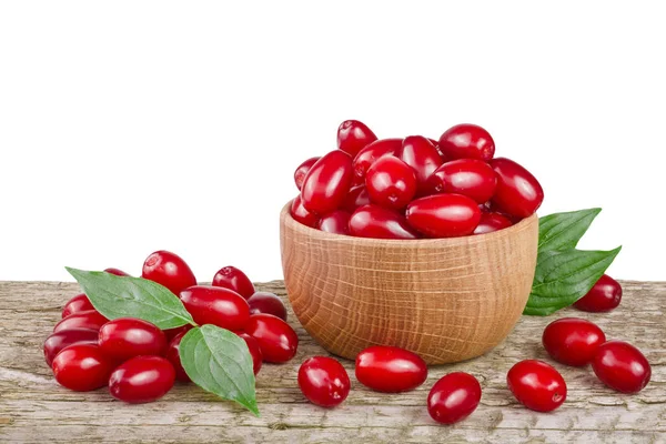 Kızılcık berry yaprak kase beyaz arka plan ile ahşap tablo