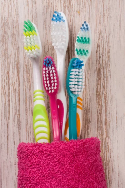 Toothbrushes on the light wooden background — Stock Photo, Image