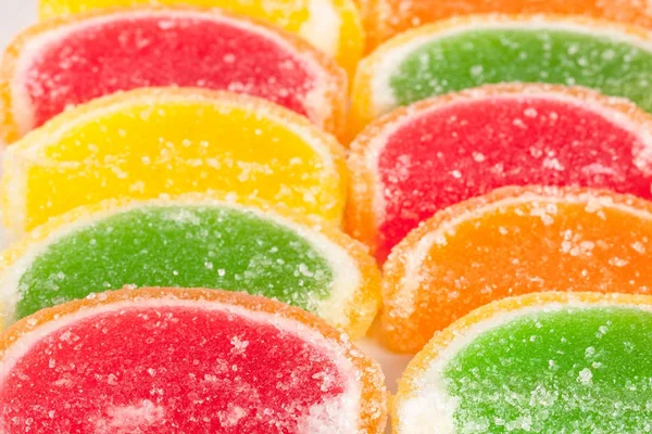 Colorful jellies like slices of lemon and orange on the market close up — Stock Photo, Image