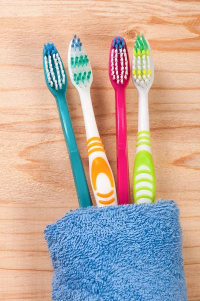 Toothbrushes on the light wooden background — Stock Photo, Image