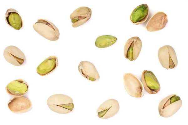 Pistacchi isolati su sfondo bianco, vista dall'alto. Modello di posa piatta — Foto Stock