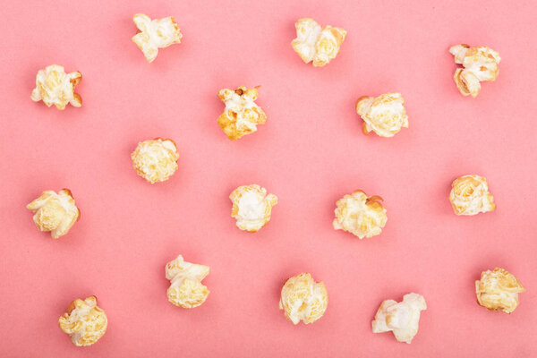 Popcorn on red background. Top view. Flat lay pattern