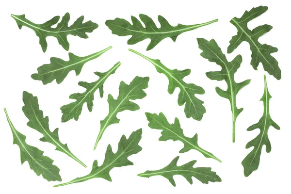 Grön färsk rucola eller ruccola blad isolerad på vit bakgrund. Ovanifrån. Lägenheten låg mönster — Stockfoto