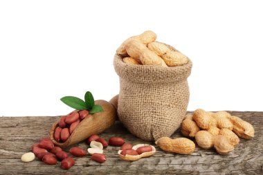 Fıstık çanta eski ahşap arka plan üzerinde yaprak ile