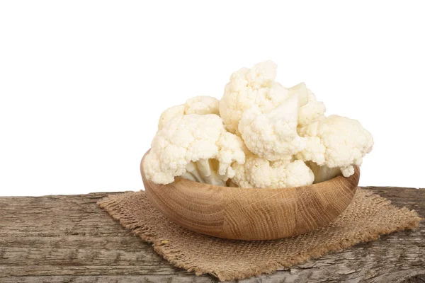 Piece of cauliflower in bowl on wooden table with white background — Stock Photo, Image