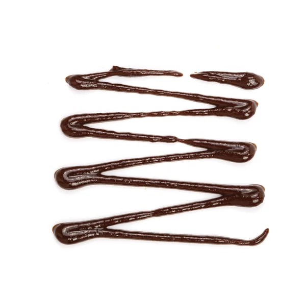 Gorący rozpuszczoną czekoladę, wylewanie na białym tle na białym tle, widok z góry — Zdjęcie stockowe