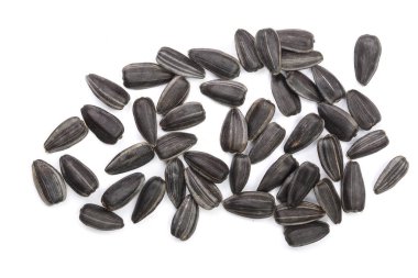 Beyaz arka planda izole edilmiş ayçiçeği tohumları. Üst görünüm