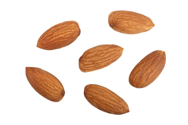 Amandes isolées sur fond blanc sans ombre en gros plan. Vue du dessus — Photo