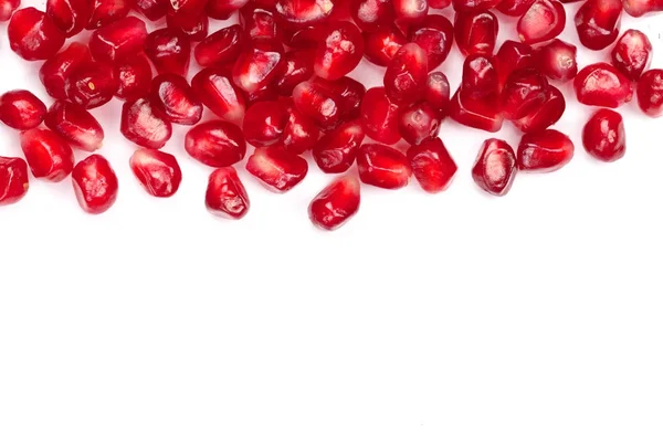 Pomegranate seeds isolated on white background with copy space for your text. Top view. Flat lay pattern — Stock Photo, Image