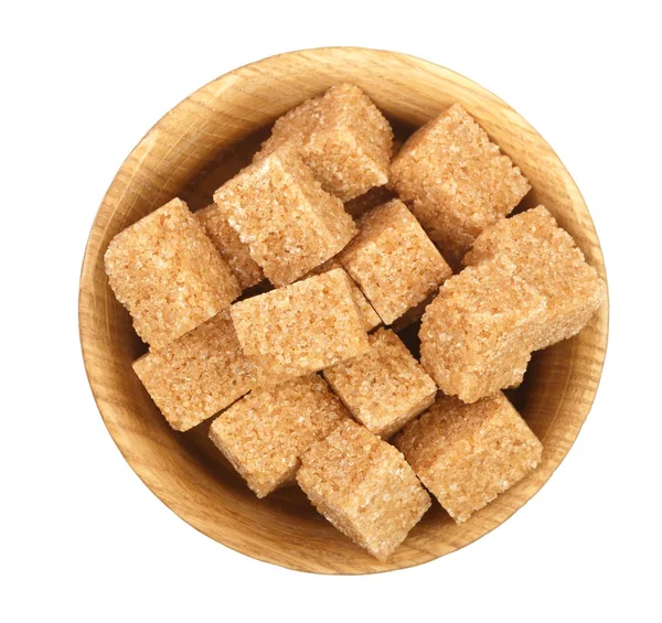 Brown sugar cubes in a wooden bowl isolated on white background. Top view. Flat lay — Stock Photo, Image