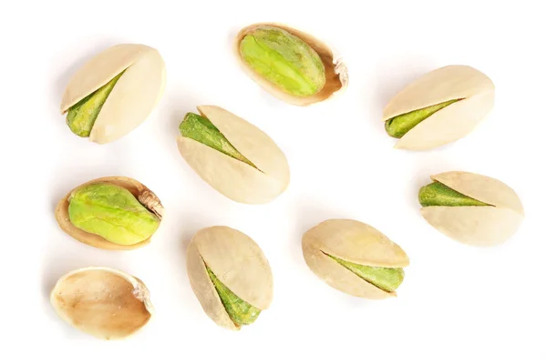 Pistacchi isolati su sfondo bianco, vista dall'alto. Posa piatta — Foto Stock