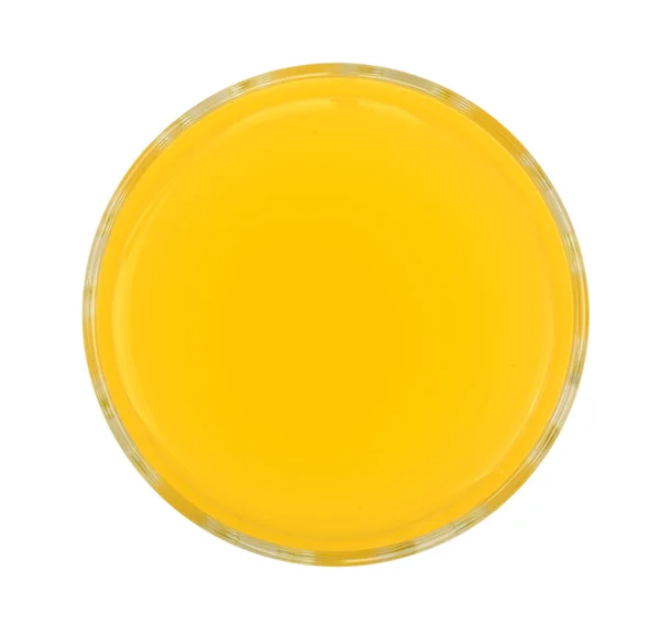 Apelsin eller ananas juice i ett glas isolerade på vit bakgrund. Ovanifrån — Stockfoto