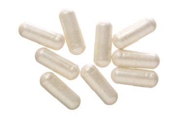 Beyaz arka plan üzerinde izole beyaz hap kapsül. Üstten Görünüm. Düz yatıyordu