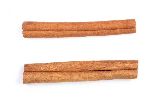 Cinnamon sticks isolated on white background. Top view — Stock Photo, Image