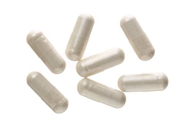 Beyaz arka plan üzerinde izole beyaz hap kapsül. Üstten Görünüm. Düz yatıyordu