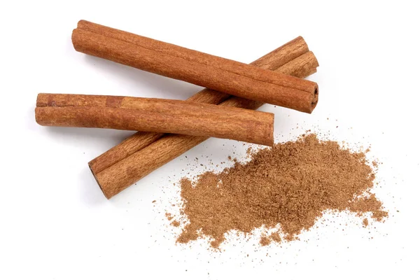 Cinnamon sticks with powder isolated on white background. Top view — Stock Photo, Image
