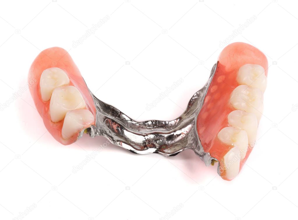 Clasp prosthesis with lock fixation isolated on white background macro